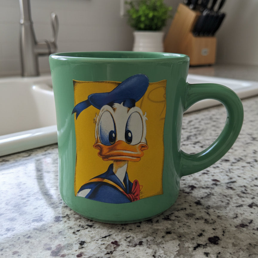 Disney Donald Duck Diner Style Coffee Mug Cup Green Outside Yellow Inside Blue Rim 3 7/8"