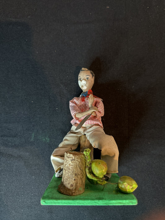 Vintage Folkart Doll Figurine Hand Painted Face Chopping Coconuts. Some Damage