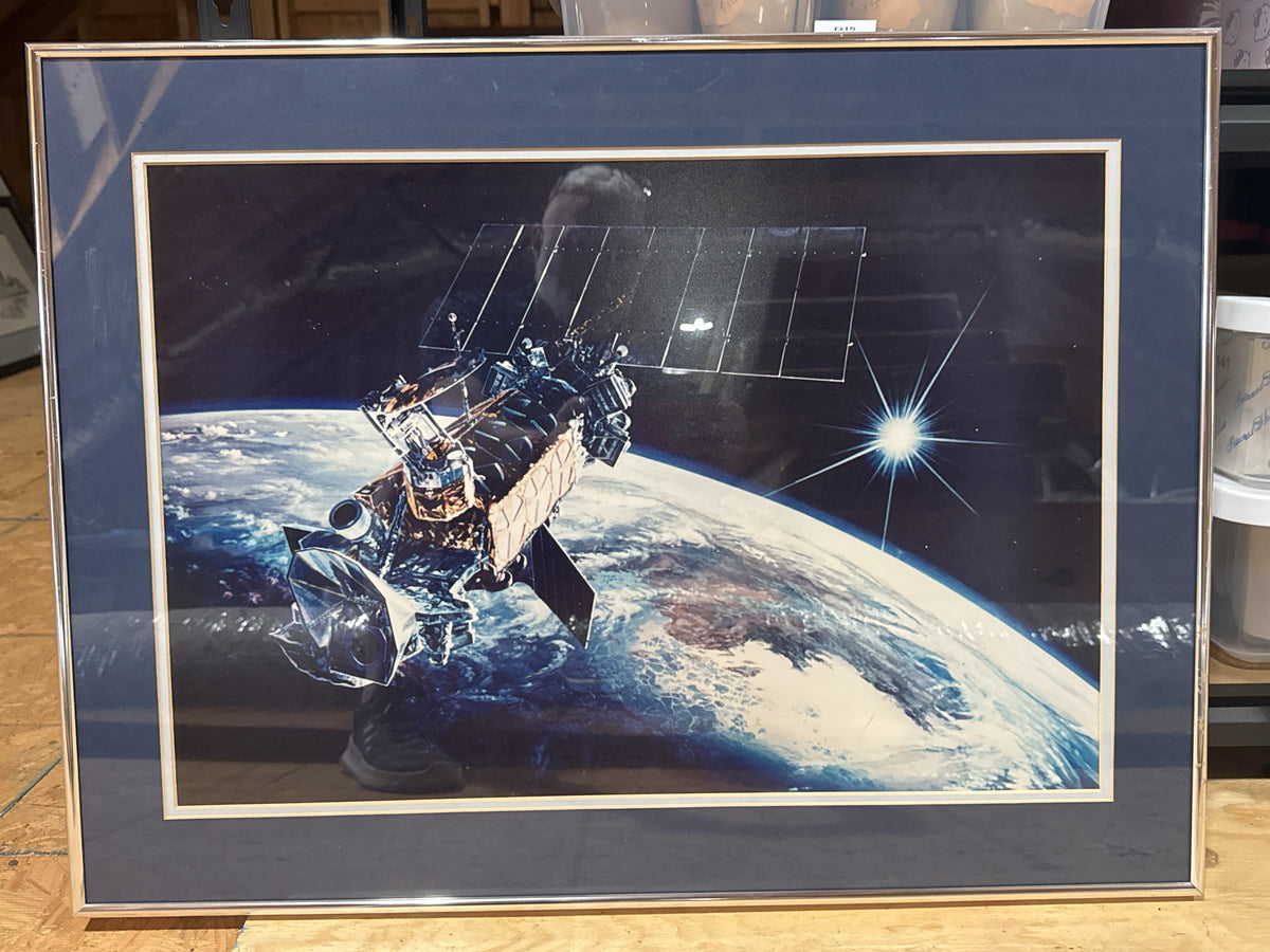 Defense Meteorological Satellite Program (DMSP) Above Earth Framed size 28" x 21"